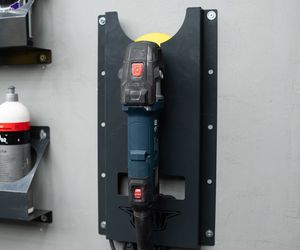 Iron barbell on a specialized storage wall mount